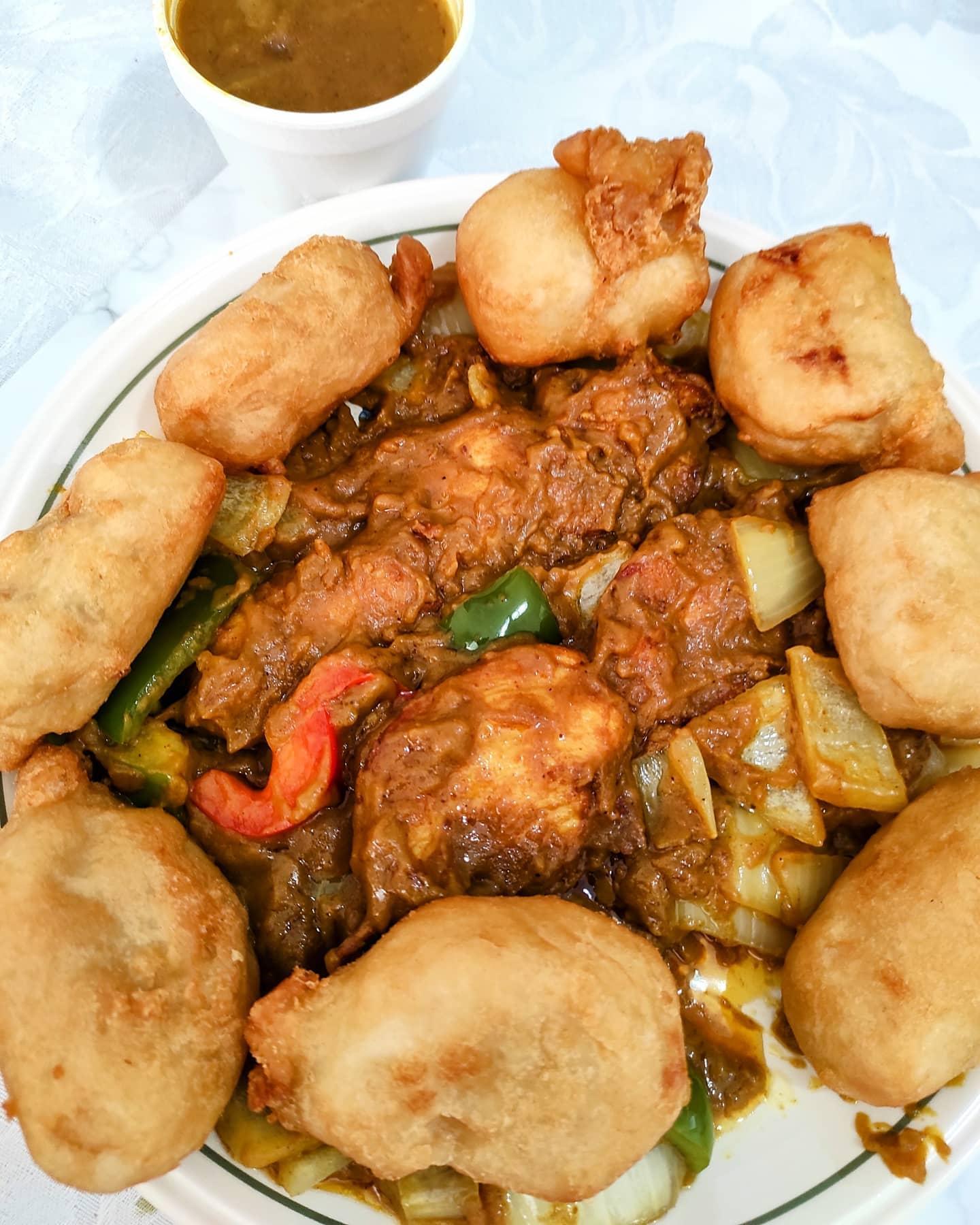 - Chicken satay on skewers with chicken balls and satay sauce.