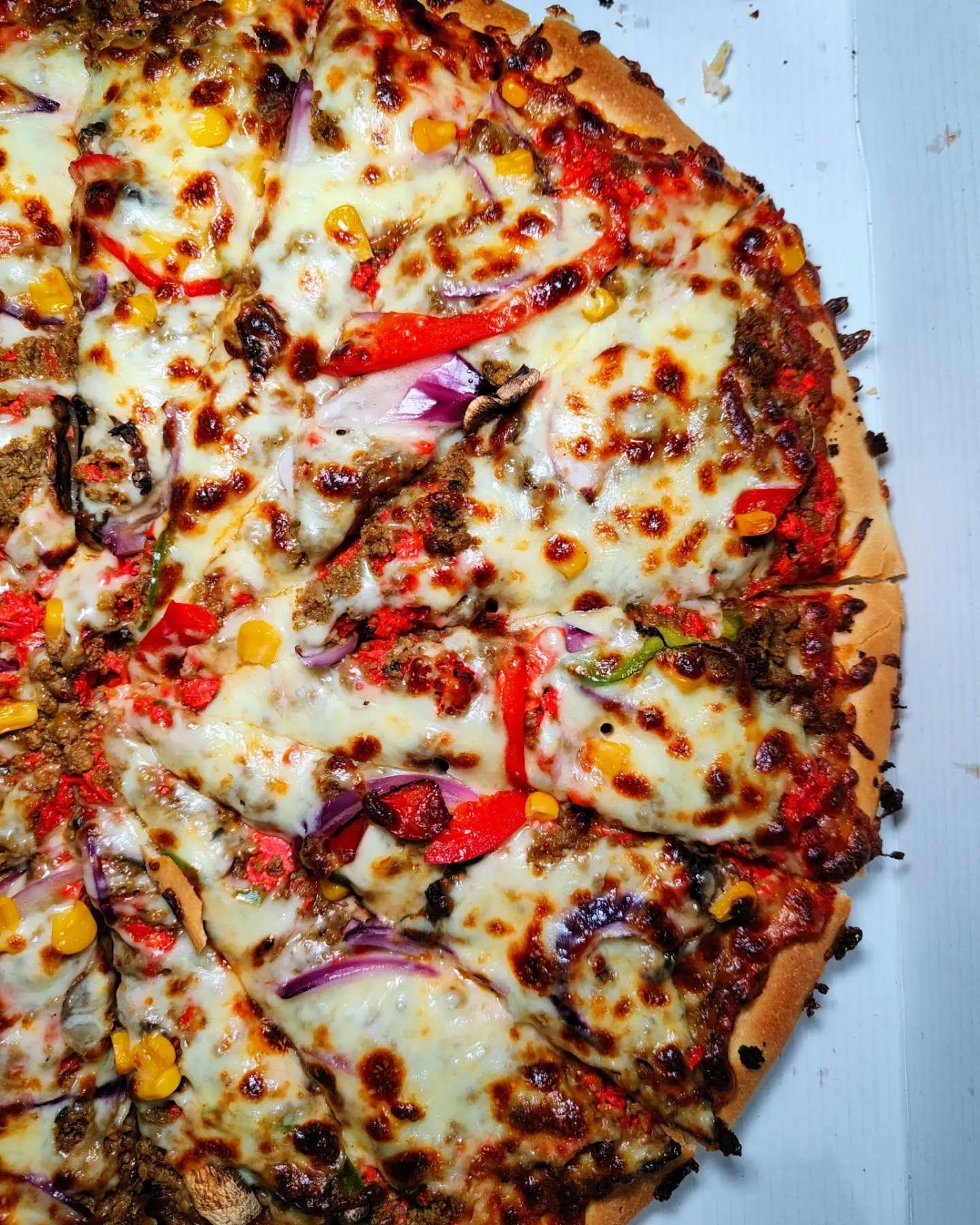  - 16 inch cha chas special pizza - spicy chicken, spicy mince, onion, peppers, mushroom and sweetcorn.