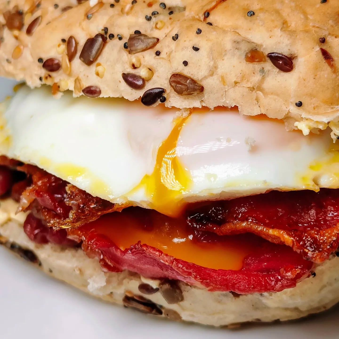  - Oh, lassie, let me tell ye aboot the best bacon and egg roll ye'll ever taste! It's a bonnie wee creation, made with a @hovisbakery deli rolls that's just the right amount of chewy, filled with thick-cut bacon that's been cooked to perfection, and a big, beautiful egg that's fried just the way ye like it.